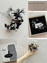 A hand showcases a decorative floral piece with black and silver accents next to a handcrafted jewelry box and card. Text reads: "Roses begin above thorns." Close by, CAMELLIA's Customized Symbol Flower Ring elegantly reflects artisan craftsmanship.